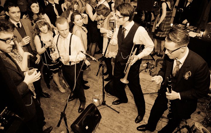 Shirt Tail Stompers performing amongst a crowd of people