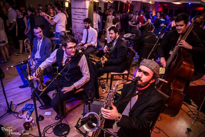 Jazz band playing amongst a crowd of people